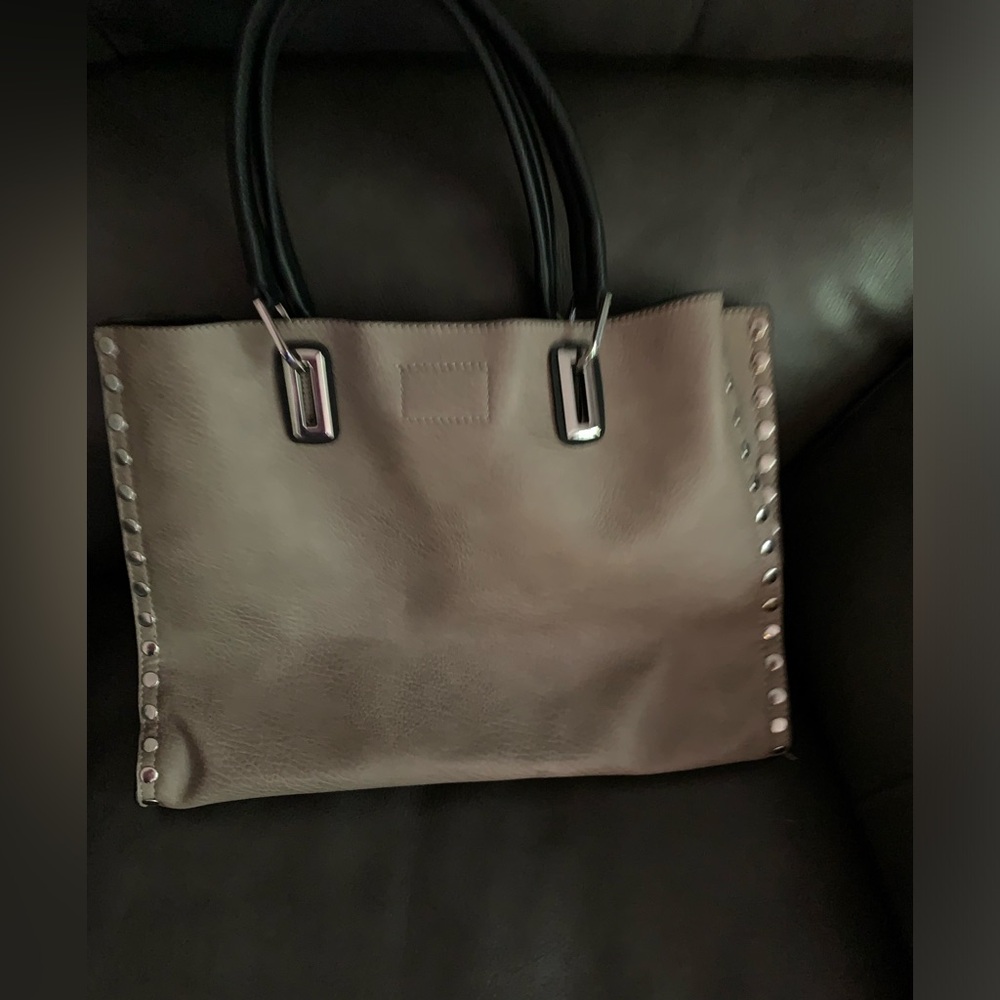Brown purse lined with silver studs also with a smaller pouch style purse.